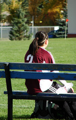 Injured Soccer Girl with Ice on Bench