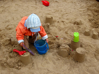 baby girl and sand