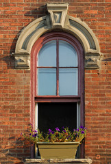Fototapeta na wymiar Arched Window of old building