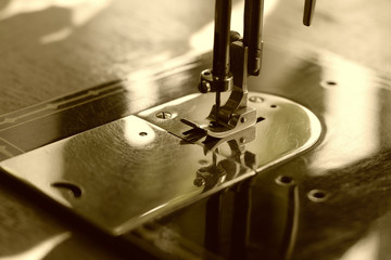 Old sewing machine in sepia
