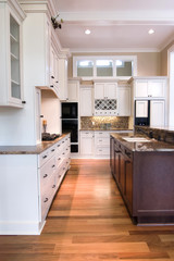 luxury kitchen with white and wood cabinets