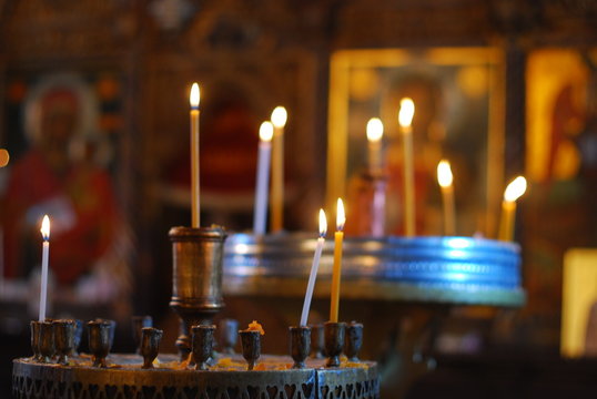 burning candles in an empty church