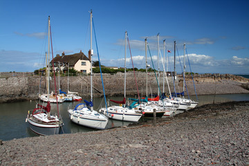 Fototapeta na wymiar Sailing Boats at Anchor in an English Harbour