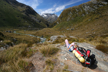 Hiker Resting In The Mountains