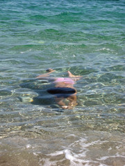 girl diving in aegean sea 