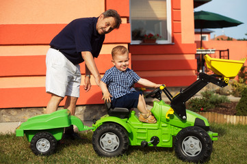 Grandfather and gradson play