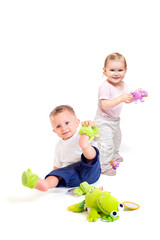 Fototapeta premium Babies play with toys