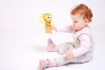 Redhead baby playing