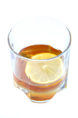 Cognac in a glass, with lemon