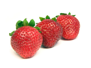 Three strawberries isolated on white background.