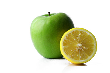 Naklejka na ściany i meble Green apple and a half of lemon.