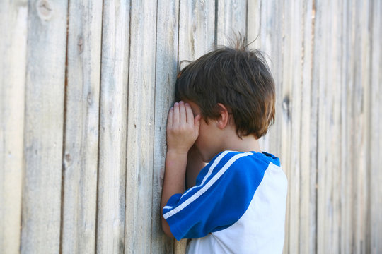 Boy Playing Hide And Go Seek