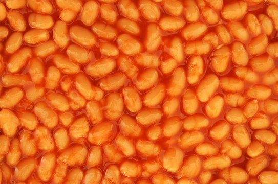 Baked beans in tomato sauce as background texture