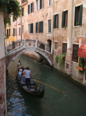 Fototapeta na wymiar gondola on narrow canal Venice