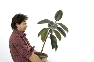 Man carrying a plant