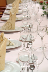 large dinner table set up for a lot of people