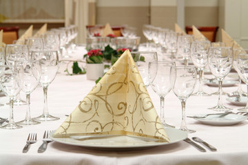 large dinner table set up for a lot of people