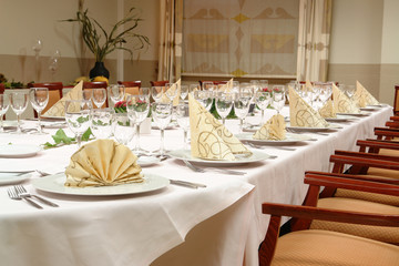 large dinner table set up for a lot of people