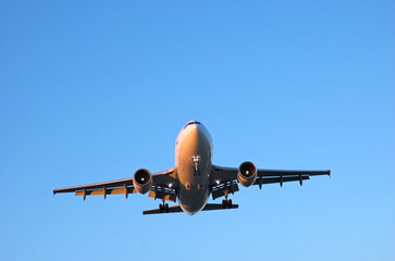 Wide body airliner in blue sky