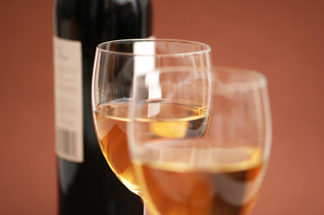 Two wine  glasses and a bottle of wine