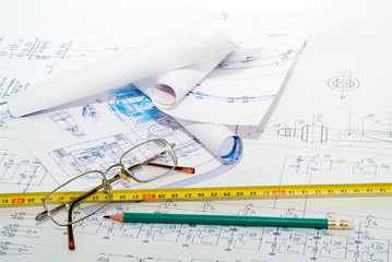 Business accessories on a background of diagrams.