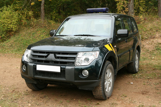 Special force`s patrol jeep in forest.