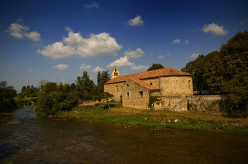 Fototapeta na wymiar French countryside village church blue sky river