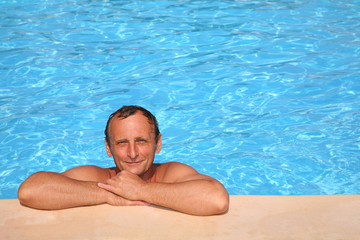 man near the pool