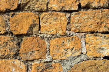 Old orange and grey brick wall, texture and background