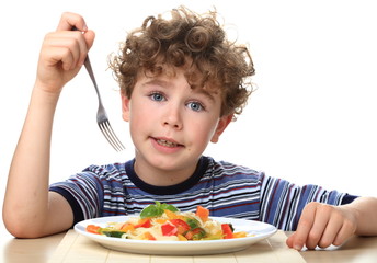 Boy eating pasta