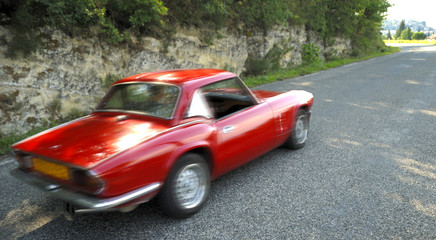 red sports car  with motion blur