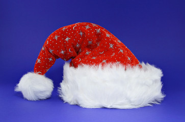Red santa hat on blue