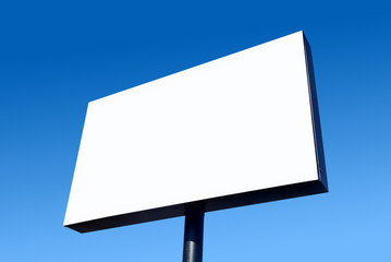 White blank billboard and a blue sky.