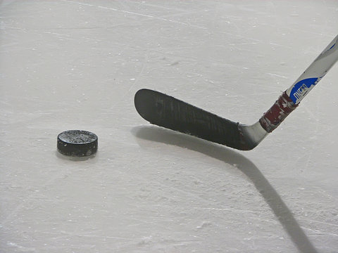hockey puck and stick