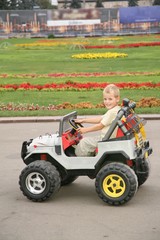 Naklejka premium boy on toy car