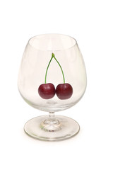 Glass with cherries isolated on the white