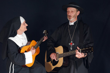 Nun and priest playing the guitar