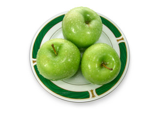 tree green apples on plate