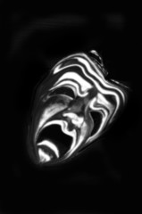 The mask of tragedy rendered as a ghost