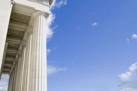 Stone Columns with Portico roof with Blue Sky area for your text