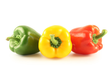 Three multi-coloured pepper isolated on white