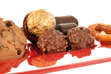 sweets on red glass plate