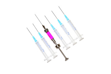 various syringes in row on white background