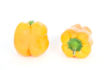 Two yellow bell peppers