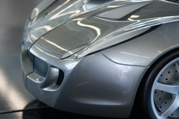 Scale model of silver sports car - Powered by Adobe