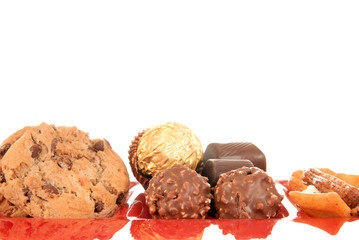 sweets on red glass plate