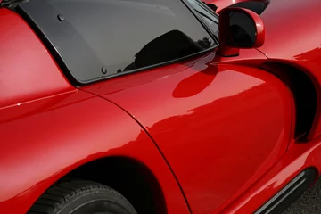 Photo sur Aluminium Voitures rapides côté de la voiture exotique rouge