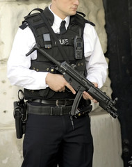 armed british police officer on duty