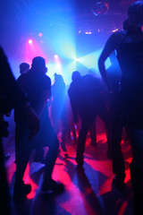 Dancing people in an underground club - obrazy, fototapety, plakaty