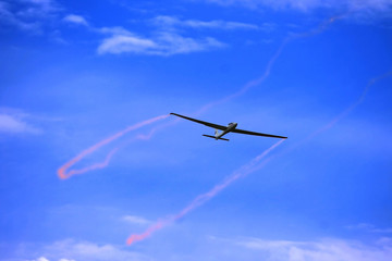 A gliders shot from below against a blue sky